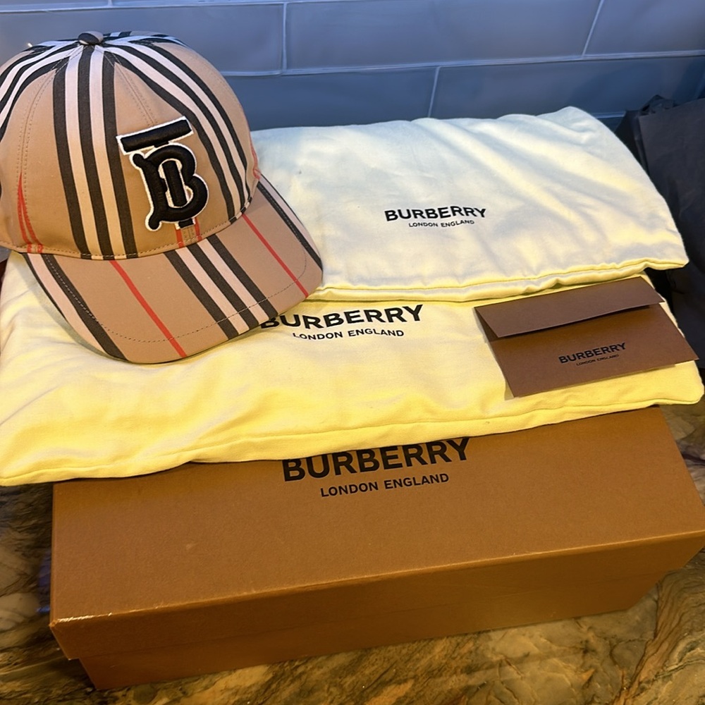 Burberry hat NEVER USED. Brand new comes with two dust bags and box. - Picture 4 of 4